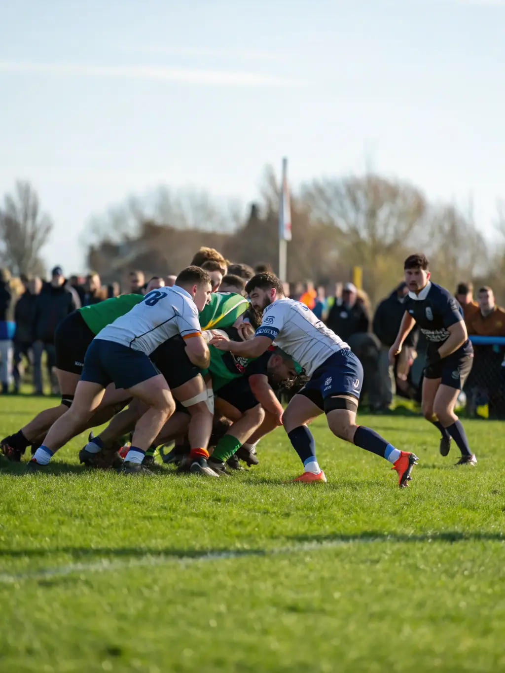 A photo of RCAV Rugby Club members participating in a rugby tournament, showcasing the competitive spirit and camaraderie.